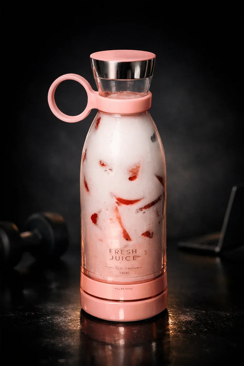 Botella licuadora portátil rosa LicuaFresh ToGo con batido de fresa